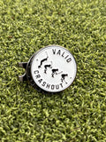 A round metal golf ball marker and hat clip with a white face and black graphics, featuring the text 'VALID CRASHOUT' from Big Max viral Instagram golf video. 